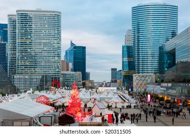 Christmas tree and market among the skyscrapers in Paris, France