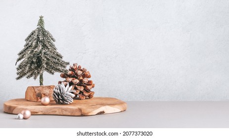 Christmas Tree Miniature, Candle And Pine Cone On Wooden Board, Mini Tabletop Decor. Christmas Web Banner, Copy Space