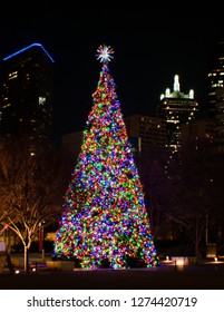 Christmas Tree With Multi Colored Lights At Night In Klyde Warren Park, Dallas.