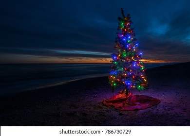 Christmas Tree On Beach At Sunset