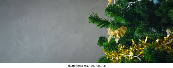 Christmas tree on cement gray polish wall background include space for add text or graphic , dimention ratie is for facebook cover page use