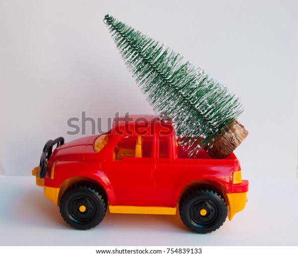 red toy truck with christmas tree