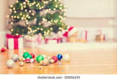 Christmas Tree And Christmas Ornaments On Floor