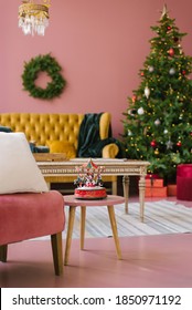 Christmas Tree In Pink Living Room Style. Vintage Sofa, Table, Banquette, Carousel On A Stool. Christmas Background.