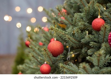 Christmas Tree With Red Decorations And Lights Close Up