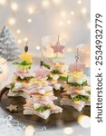 Christmas tree sandwich  canapes, tasty appetizer for holiday table