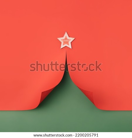 Christmas tree shaped paper cutout with green and red background. Christmas holiday minimal concept.