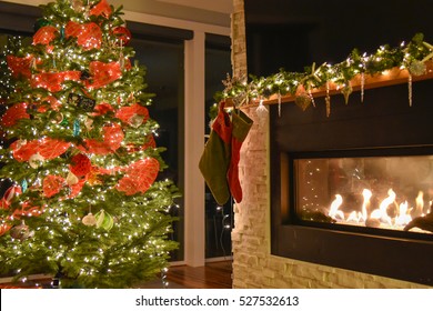 Christmas Tree, Stockings Hung On The Mantle Over The Fireplace.