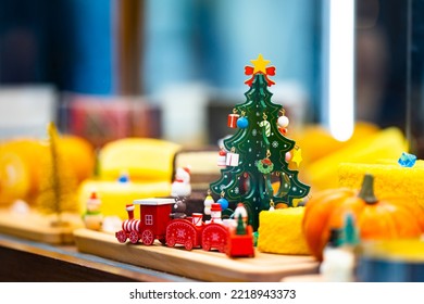 Christmas Tree Wood Toy Decorate In Display Mirror Box In Cheese Cake Shop.