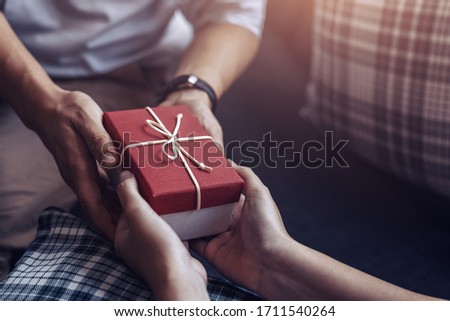 christmas, valentine, holidays gift box concept. Couple surprise gift box together.