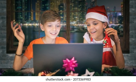 Christmas Video Call With The Family - Concept Of Family Celebrating Xmas Holiday Online Due Covid-19 Restrictions – Little Carol Singers Kids On Virtual Christmas Party