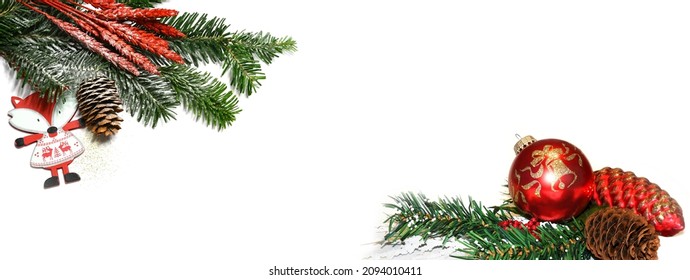 Christmas white background banner with fir tree branch, pine cones, christmas spheres and decorations