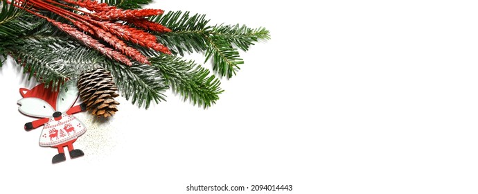 Christmas white background banner with fir tree branch, pine cones, and decorations
