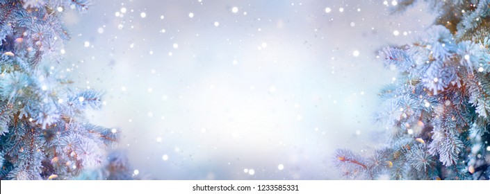 Christmas winter background. Xmas trees covered snow with garland lights, holiday festive background. Widescreen frame backdrop. New year Winter art design, Christmas scene