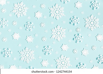 Christmas or winter composition. Pattern made of snowflakes on pastel blue background. Christmas, winter, new year concept. Flat lay, top view