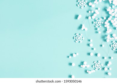 Christmas or winter composition. Pattern made of snowflakes and snowballs on pastel blue background. Christmas, winter, new year concept. Flat lay, top view, copy space