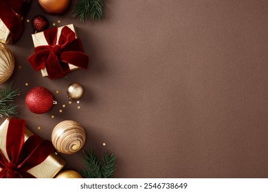 Christmas or winter holidays background with red and gold ornaments, gift boxes, pine branches, and stars on a brown background. Flat lay, top view, copy space - Powered by Shutterstock