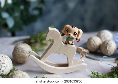 Christmas, Winter, New Year Concept. Gift Toy Wooden Horse And Toy Dog