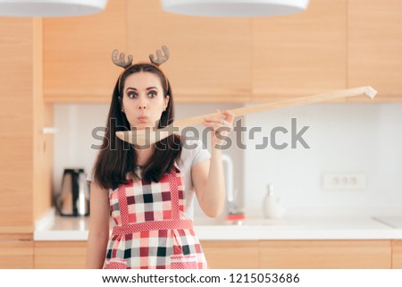 Christmas Woman with Big Spoon Ready to Cook for Holidays. Female home cook preparing holiday menu for party
