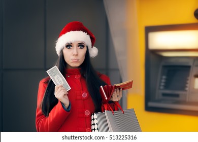 Christmas Woman Holding One Dollar In Front Of An ATM  - Funny Girl Having No Money Checking Account Balance 
