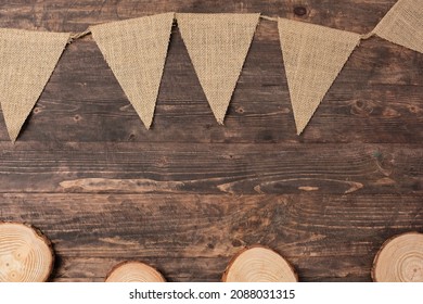 Christmas Wood Log Plate And Kraft Flag On Brown Wooden Table