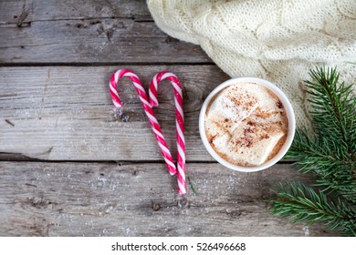 Christmas wooden background with christmas decoration and cocoa with marshmallow and fir branch, top view