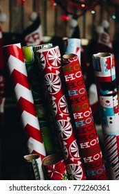 Christmas Wrapping Paper Rolls In Front Of Christmas Background