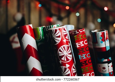 Christmas Wrapping Paper Rolls In Front Of Christmas Background