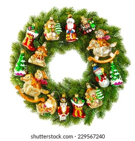 Christmas Wreath Decorated With Ornaments, Baubles And Vintage Toys Isolated On White Background