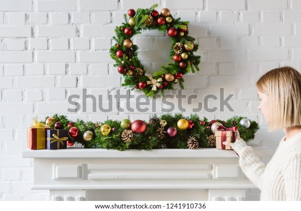 Christmas Wreath Decorations Over Fireplace Mantel People