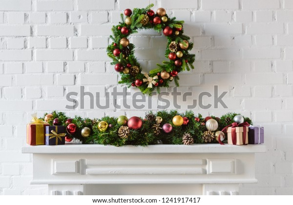 Christmas Wreath Decorations Over Fireplace Mantel Stock Photo