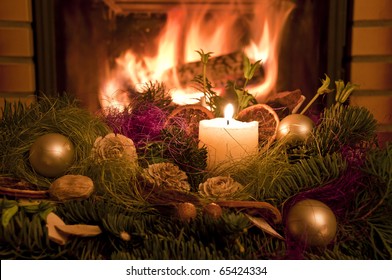 Christmas Wreath In Front Of The Fireplace.