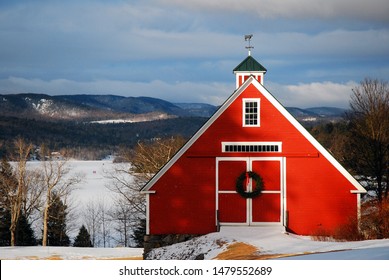 A Christmas Wreath Hands On A New England Barn