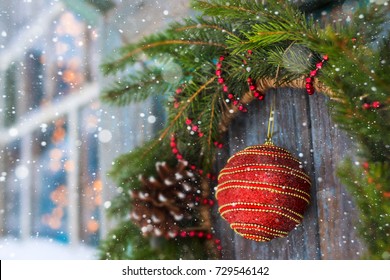 Christmas wreath on a door with a bump and a ball horizontal - Shutterstock ID 729546142