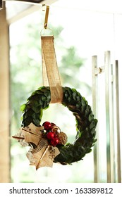 Christmas Wreath On The Glass Door In Shop.