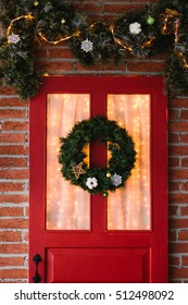 Christmas Wreath On Red Door