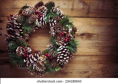 Christmas Wreath On A Rustic Wooden Front Door