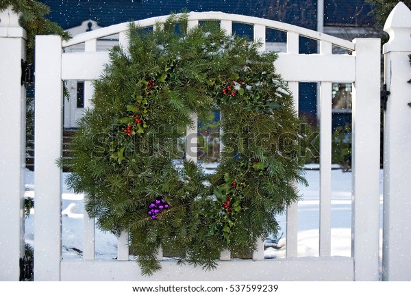 Christmas Wreath On White Fence Gate Royalty Free Stock Image