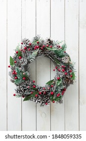 Christmas Wreath On White Wooden Background. Winter Holiday - Traditional, Rustic Home Decoration. Layout With Free Copy (text) Space.