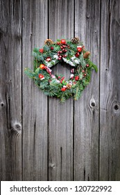 Christmas Wreath On The Wooden Background