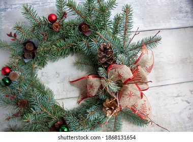 Christmas wreath on wooden tabletop