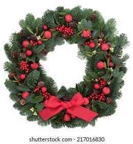 Christmas Wreath With Red Bauble Decorations And Bow, Holly, Ivy, Mistletoe, Fir And Pine Cones Over White Background.