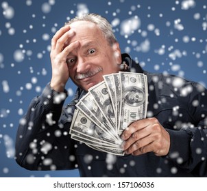 Christmas, X-mas, Sale, Banking Concept - Lucky Old Man Holding Group Of Dollar Bills. Focus On Money