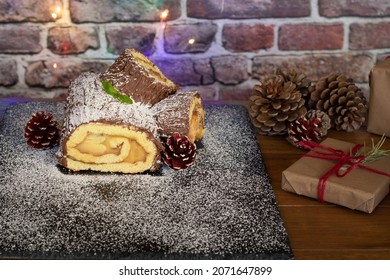 Christmas yule cake is recorded on a dark background. Traditional Christmas dessert. Selective focus.Traditional Christmas Buche de Noel cake. - Shutterstock ID 2071647899