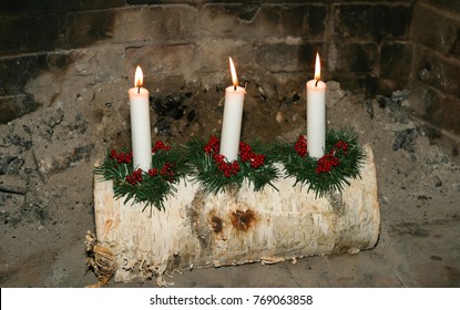 Christmas Yule Log With Three Lit Candles