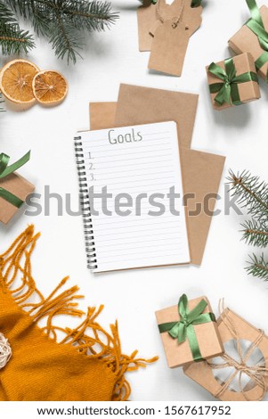 Christmas zero waste flat lay , eco friendly packaging. Festive Christmas composition packs gifts in kraft paper on a light table, eco Winter weekend concept, eco decor