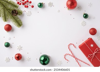 Christmas-themed flat lay with red and green ornaments, candy canes, and a gift on a white background exuding holiday cheer - Powered by Shutterstock