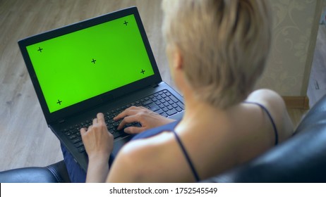 Chroma Key On Laptop Screen. Look Over Your Shoulder. Woman Uses Laptop At Home.