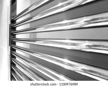 Chrome Bathroom Radiator In Black And White.