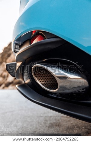 Chrome exhaust tip on a sports car